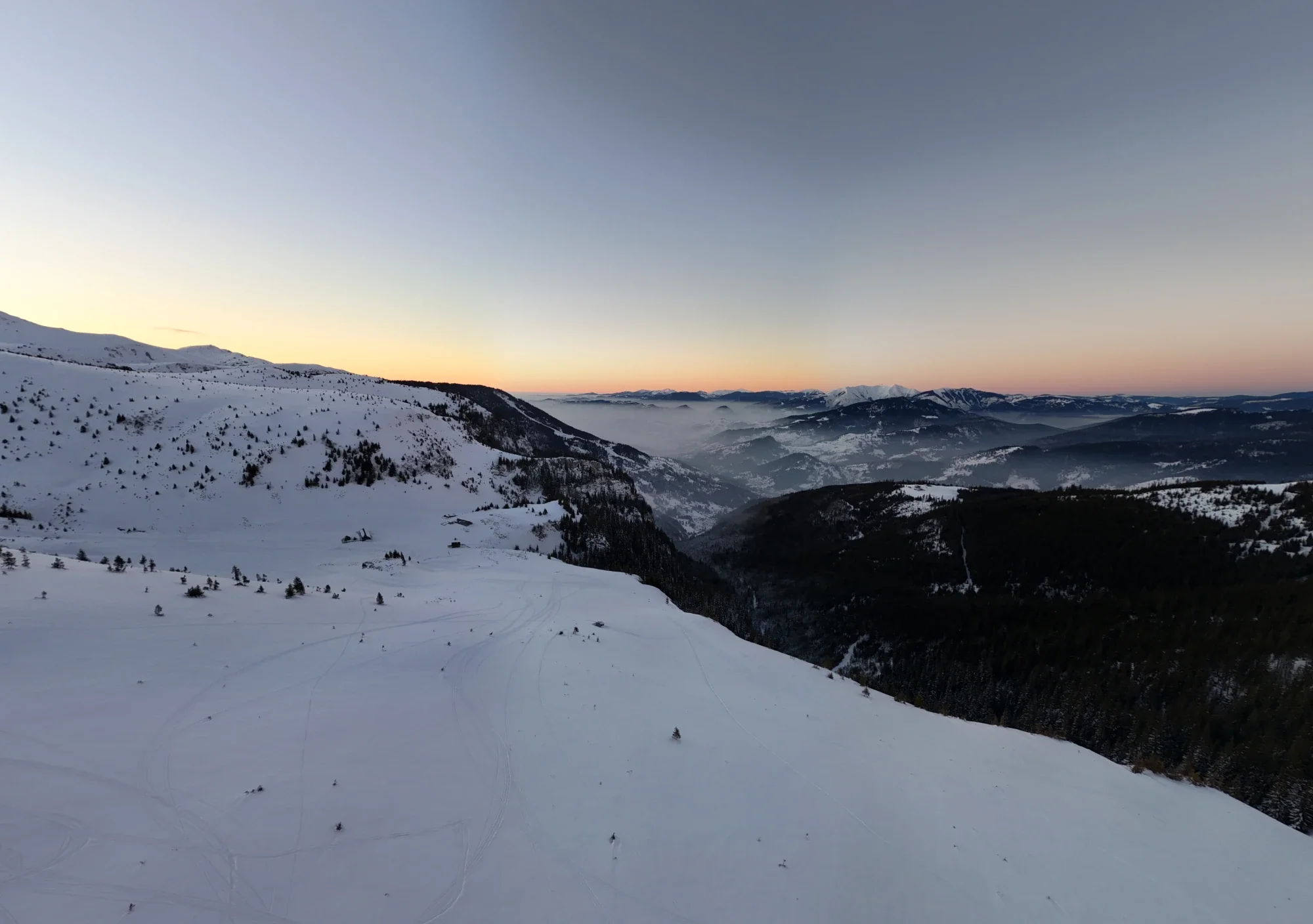 Drone view of Vârful Gârgalău at sunset in winter, Rodna Mountains, Romania